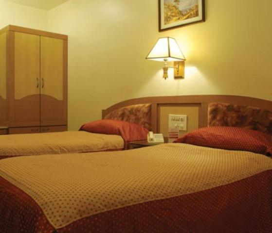 The Ambience Hotel Púna Szoba fotó