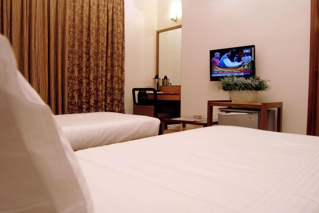 The Ambience Hotel Púna Szoba fotó