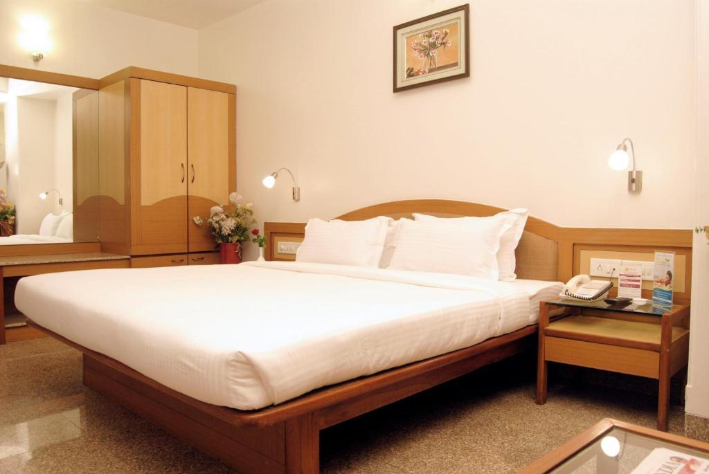 The Ambience Hotel Púna Szoba fotó