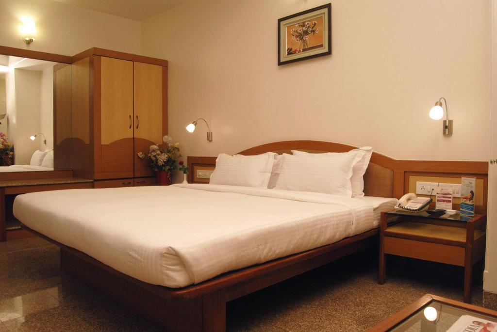 The Ambience Hotel Púna Szoba fotó
