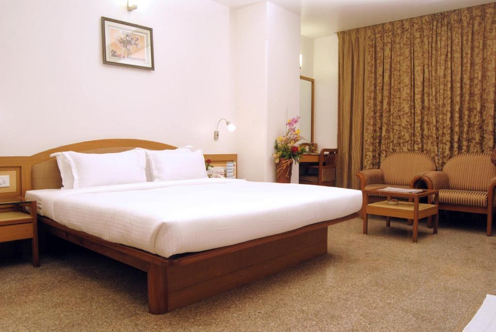 The Ambience Hotel Púna Szoba fotó